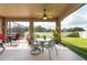 The covered patio features outdoor furniture and provides a comfortable space for relaxation and entertaining at 10428 Arbor Groves Pl, Riverview, FL 33578