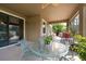 Covered and screened lanai features ample seating and offers a serene outdoor experience at 10428 Arbor Groves Pl, Riverview, FL 33578