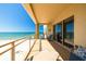 Balcony overlooking the beach featuring sliding glass doors, comfortable seating and ocean views at 11 Baymont St # 1403, Clearwater Beach, FL 33767