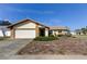 Charming single-Gathering home with a two-car garage, stone accents, and manicured landscaping at 11429 Nest Ct, Port Richey, FL 34668