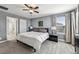 Comfortable main bedroom with soft carpet, fan, side tables, natural light, and calming ambiance at 11603 Fringetree Ct, Riverview, FL 33579