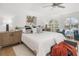 Main bedroom with arched windows, modern decor, and a view of the pool area at 12027 Wandsworth Dr, Tampa, FL 33626