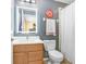 Cozy bathroom with vanity, framed mirror, toilet, and shower featuring a curtain at 1208 Chatham Pine Pl, Brandon, FL 33511