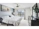 Bright bedroom with a ceiling fan, a bed, and a dresser with a decor mirror at 1208 Chatham Pine Pl, Brandon, FL 33511