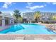 Community pool area features a large pool, brick patio, lounge chairs, and a covered pavilion at 1208 Chatham Pine Pl, Brandon, FL 33511