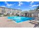 Community pool with brick patio, lounge chairs, and a nearby building for shade and facilities at 1208 Chatham Pine Pl, Brandon, FL 33511