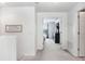 Bright hallway leading to a bedroom, showcasing a clean and inviting space at 1208 Chatham Pine Pl, Brandon, FL 33511