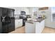 Well-equipped kitchen with stainless steel appliances, white cabinets, and granite countertops at 1208 Chatham Pine Pl, Brandon, FL 33511