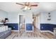 Bright living area featuring hardwood floors, ceiling fan, and a blend of modern furniture at 1208 Chatham Pine Pl, Brandon, FL 33511