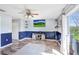 Cozy living room featuring hardwood floors, a ceiling fan, and a sliding glass door at 1208 Chatham Pine Pl, Brandon, FL 33511