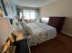 Bright bedroom with hardwood floors, large windows, and comfortable furnishings creating a relaxing space at 1235 S Highland Ave # 1-204, Clearwater, FL 33756