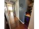 Hallway with hardwood floors, a bar area, and a wine refrigerator at 1235 S Highland Ave # 1-204, Clearwater, FL 33756