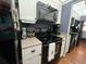 Well-equipped kitchen with black appliances, white cabinets, and ample counter space at 1235 S Highland Ave # 1-204, Clearwater, FL 33756