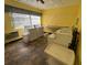 A well-lit laundry room with multiple washers, dryers, and a folding table offers convenience for residents' laundry needs at 1235 S Highland Ave # 1-204, Clearwater, FL 33756