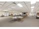 Meeting room with a stage, tables, chairs, and comfortable couches with a fireplace and a library at 1235 S Highland Ave # 1-204, Clearwater, FL 33756