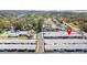 Aerial view of a condo community featuring well-maintained buildings, lush landscaping, and a refreshing swimming pool at 12400 Park Blvd # 524, Seminole, FL 33772