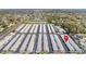 Expansive aerial view of a residential condo community showcasing orderly buildings and ample parking space for residents and guests at 12400 Park Blvd # 524, Seminole, FL 33772