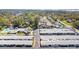Aerial view of a condo community featuring well-maintained buildings, lush landscaping, and a refreshing swimming pool at 12400 Park Blvd # 524, Seminole, FL 33772