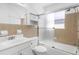 Bathroom with a shower and tub combo, updated vanity, and tiled walls for easy maintenance at 12400 Park Blvd # 524, Seminole, FL 33772