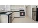 Charming kitchen area with a stainless steel dishwasher, modern appliances, and neutral cabinets at 12400 Park Blvd # 524, Seminole, FL 33772