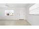 Bright living room featuring light, neutral walls, updated flooring and two windows that stream natural light at 12400 Park Blvd # 524, Seminole, FL 33772
