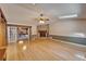 Bright living room with skylights, brick fireplace and an open layout at 13607 Mcintosh Rd, Thonotosassa, FL 33592