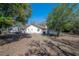 Rear exterior view showing the back yard, pool area, and RV parking space at 16740 Monteverde Dr, Spring Hill, FL 34610