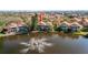 Beautiful homes nestled around a serene lake with a fountain at 18 Crescent S Pl, St Petersburg, FL 33711
