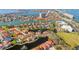 Aerial view of waterfront community featuring beautiful homes, lush landscaping, and serene lake at 18 Crescent S Pl, St Petersburg, FL 33711