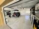 Spacious garage featuring epoxy flooring, ample storage, and a golf cart, perfect for convenience and organization at 18 Crescent S Pl, St Petersburg, FL 33711