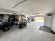 Spacious garage featuring ample storage, a golf cart, workspace, and easy access to the outdoors at 18 Crescent S Pl, St Petersburg, FL 33711