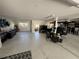 Expansive garage featuring a golf cart, organized storage, workspace, and access to indoor/outdoor living at 18 Crescent S Pl, St Petersburg, FL 33711