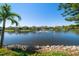 Peaceful lake view with a fountain and beautiful surrounding homes at 18 Crescent S Pl, St Petersburg, FL 33711