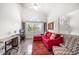 Bright living room features vaulted ceilings, a ceiling fan, and views of the outdoors at 18 Crescent S Pl, St Petersburg, FL 33711