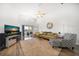 Bright living room with vaulted ceilings, stylish furnishings, and a large TV at 18 Crescent S Pl, St Petersburg, FL 33711