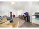 Bright living room with hardwood floors, ceiling fan, and open floor plan to the kitchen at 18 Crescent S Pl, St Petersburg, FL 33711
