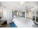 Light and airy main bedroom with built-in cabinets, ensuite bathroom, and wood-look floors at 18 Crescent S Pl, St Petersburg, FL 33711