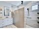 Modern bathroom with a tiled shower, sleek vanity, and elegant lighting at 18530 Gulf Blvd, Indian Shores, FL 33785