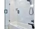 Chic bathroom featuring a glass-enclosed shower with textured walls and matte black hardware at 18530 Gulf Blvd, Indian Shores, FL 33785