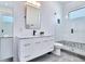 Modern bathroom showcasing a tiled shower, sleek vanity with modern fixtures, and stylish design at 18530 Gulf Blvd, Indian Shores, FL 33785