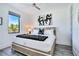 This bedroom is a bright room featuring modern decor, a ceiling fan and natural light from a window at 18530 Gulf Blvd, Indian Shores, FL 33785