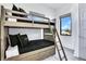 This bedroom features a bunk bed with wood frame, providing a cozy space with natural light at 18530 Gulf Blvd, Indian Shores, FL 33785