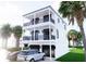 Stunning two-story home featuring double balconies, dark trim, and a spacious two-car garage at 18530 Gulf Blvd, Indian Shores, FL 33785