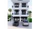 Elegant two-story home with double balconies, black trim, and a convenient two-car garage at 18530 Gulf Blvd, Indian Shores, FL 33785