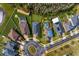 Aerial view of a neighborhood featuring well-maintained lawns, mature trees, and inviting curb appeal at 19476 Paddock View Dr, Tampa, FL 33647