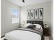 A stylish bedroom features a large bed, contemporary decor, and natural light at 19476 Paddock View Dr, Tampa, FL 33647