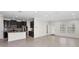 Spacious kitchen with breakfast bar and stainless steel appliances, adjoining a large, open living space at 19476 Paddock View Dr, Tampa, FL 33647