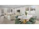 Bright, open-concept living and dining area with modern furnishings and ample natural light at 19476 Paddock View Dr, Tampa, FL 33647