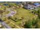 Aerial shot of a charming community playground with vibrant green space, perfect for Gathering fun at 19476 Paddock View Dr, Tampa, FL 33647