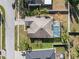 Aerial view of a single-Gathering home with a screened in pool and a well-manicured lawn at 22516 Magnolia Trace Blvd, Lutz, FL 33549